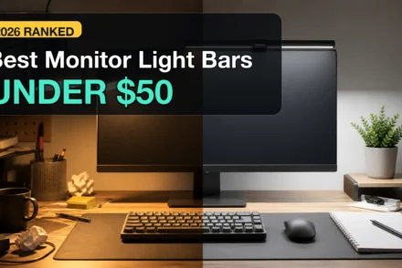 Monitor light bar clipped above a desk monitor, lighting the keyboard and desk surface